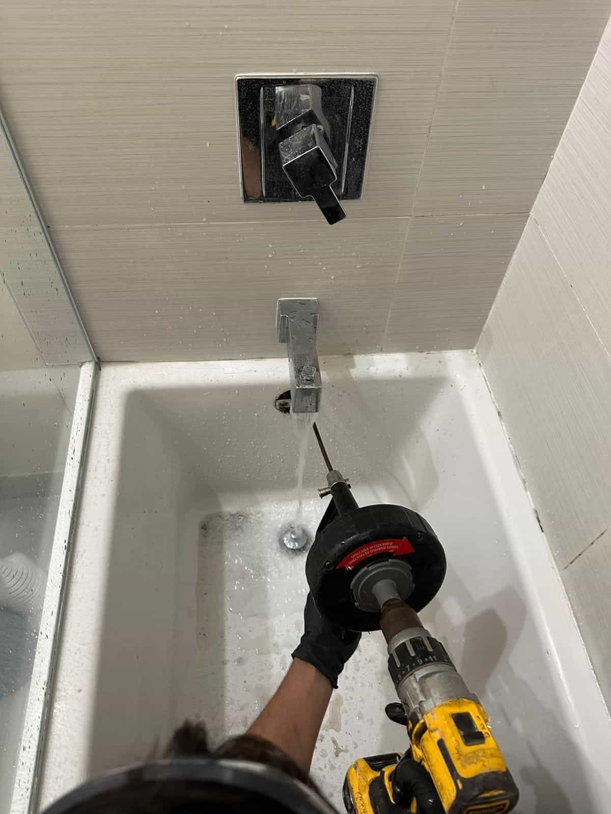 Before and after of a Drain cleaning by a plumber in Key Biscayne